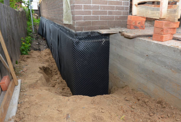 Happy homeowners after waterproofing job in Weidman